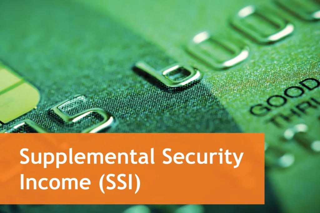 Close-up of a green debit card with embossed numbers representing Supplemental Security Income (SSI).